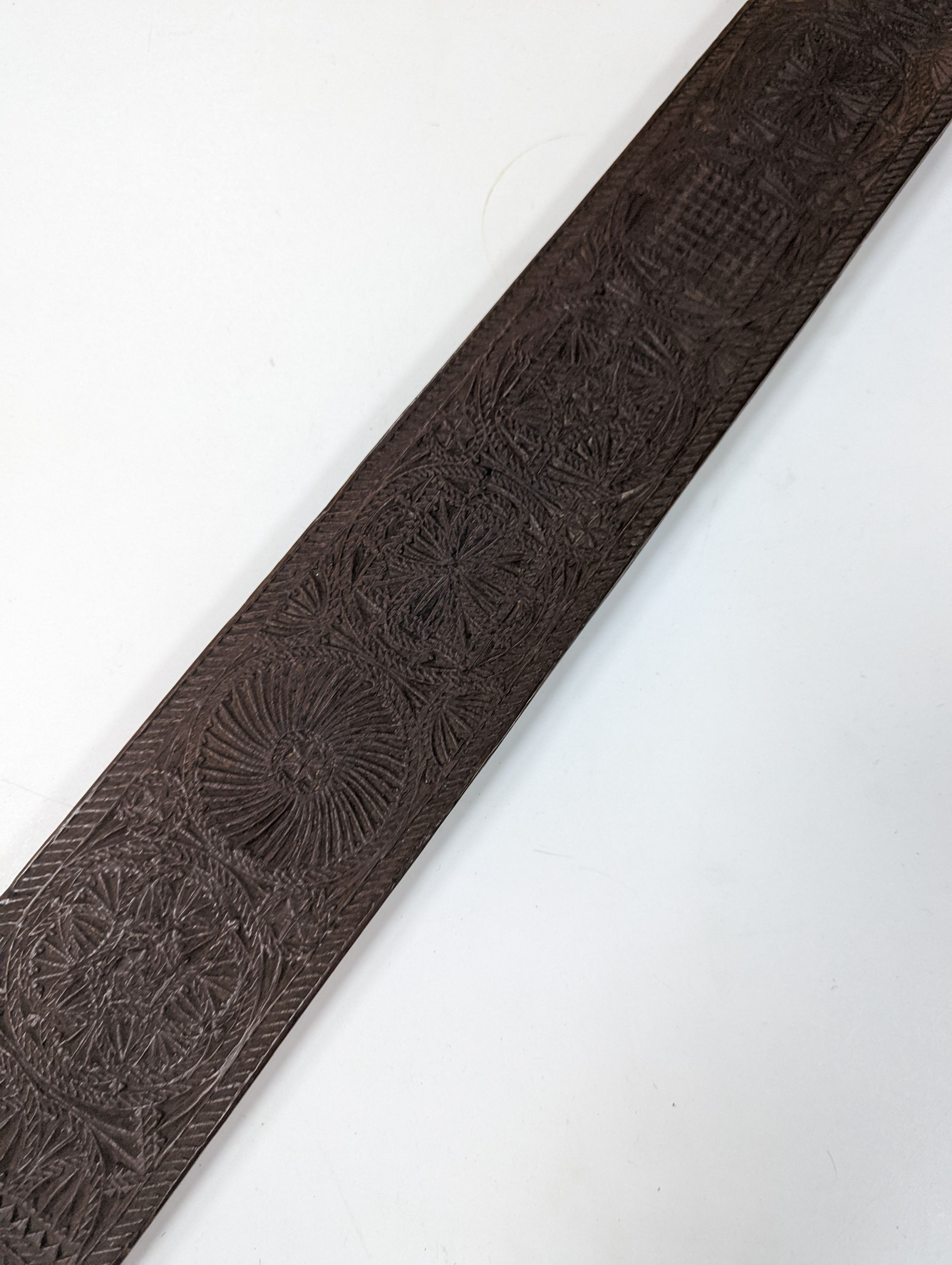 An 18th century Norwegian chip carved oak mangle board, dated 1730, 77cm